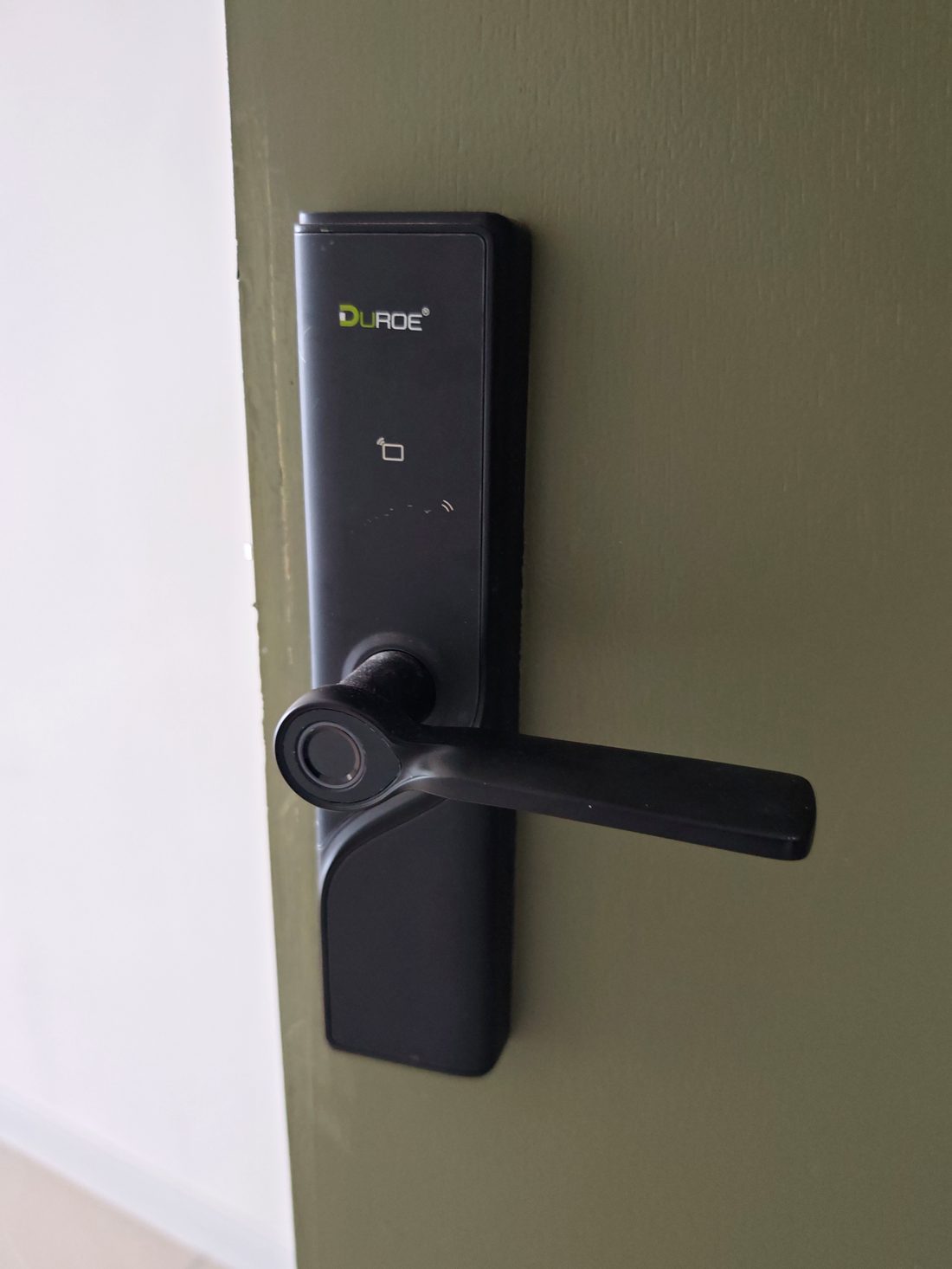 Digital smart lock on the main entrance door at Dedaun Residensi