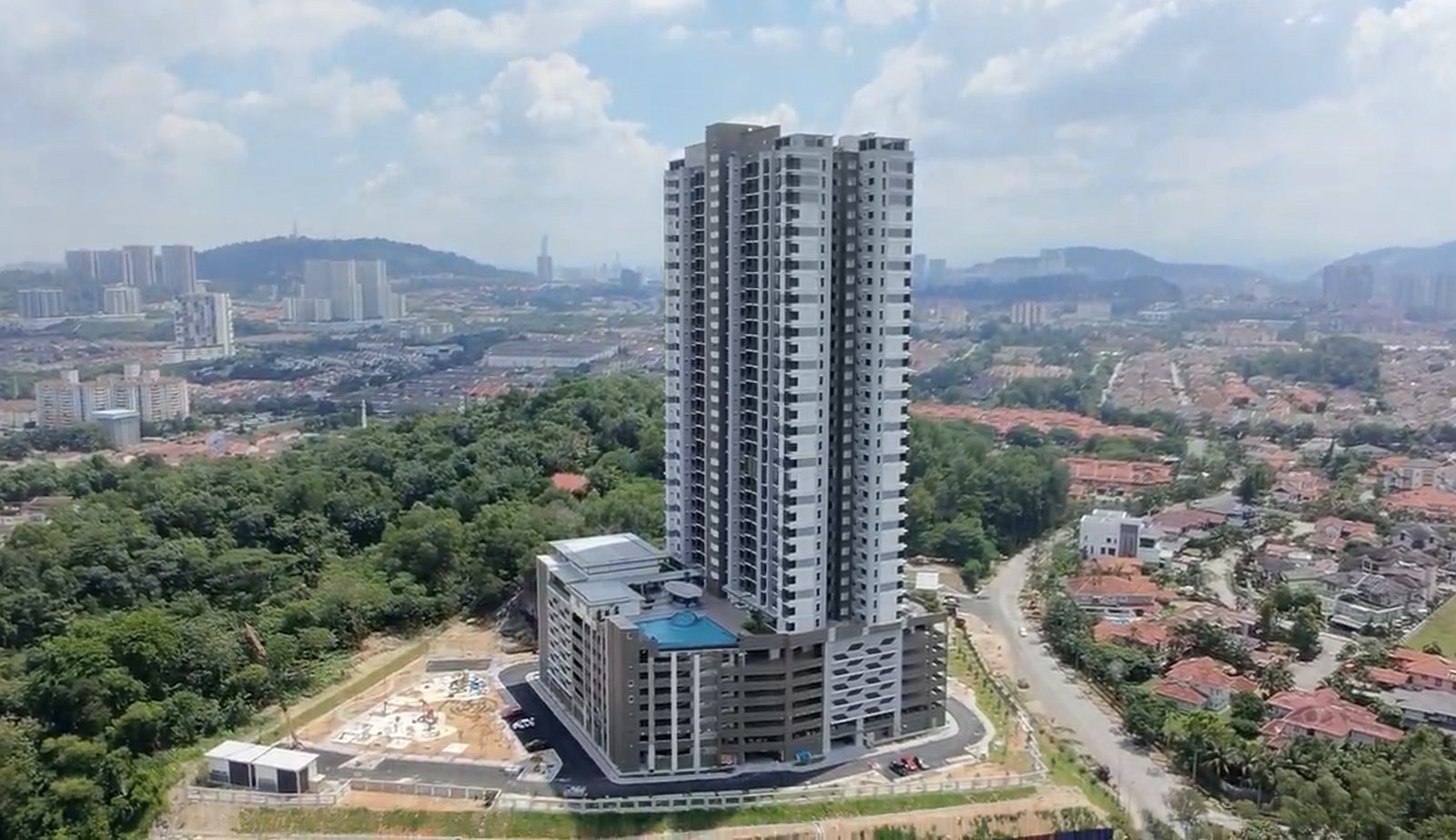 Completed Dedaun Residensi tower and pool deck, July 2026